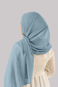 Woman effortlessly styling in a Sapphire Georgette Hijab with built-in cap, ideal for all-day wear