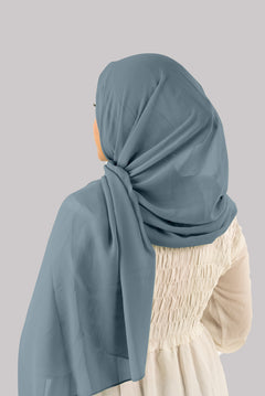 Back view of a woman Draping yale color georgette instant hijab with cap. featuring luxurious elegance and sophistication. Premium quality Georgette Hijab with matching cap. 