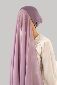 a women wearing instant hijab with cap in mauve color georgette material side profile