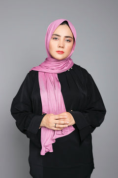 Woman wearing a stylish Dark Mauve Jersey Hijab looking front.