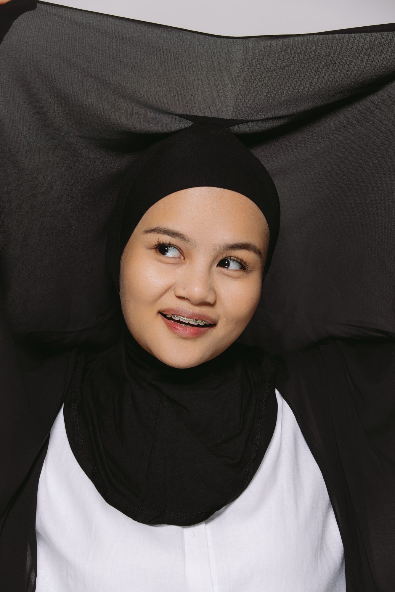 a girl wearing a Georgette instant hijab with a jersey ninja cap. 