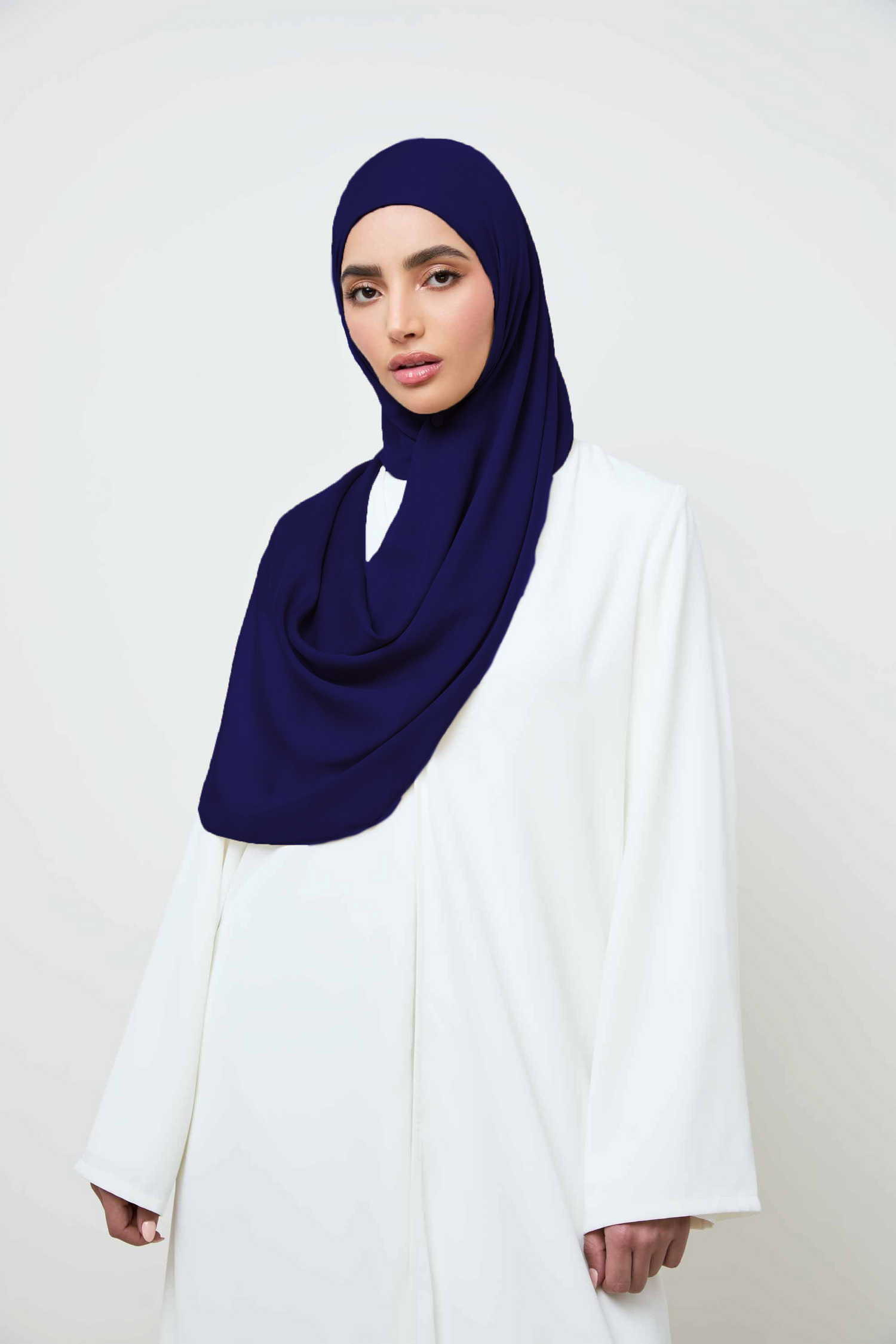 Girl wearing modal hijab in navy blue, shop online at Hijabandco Pakistan.