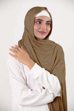 Elegant Almond Ribbed Jersey Hijab draping gracefully on a modern hijabi.