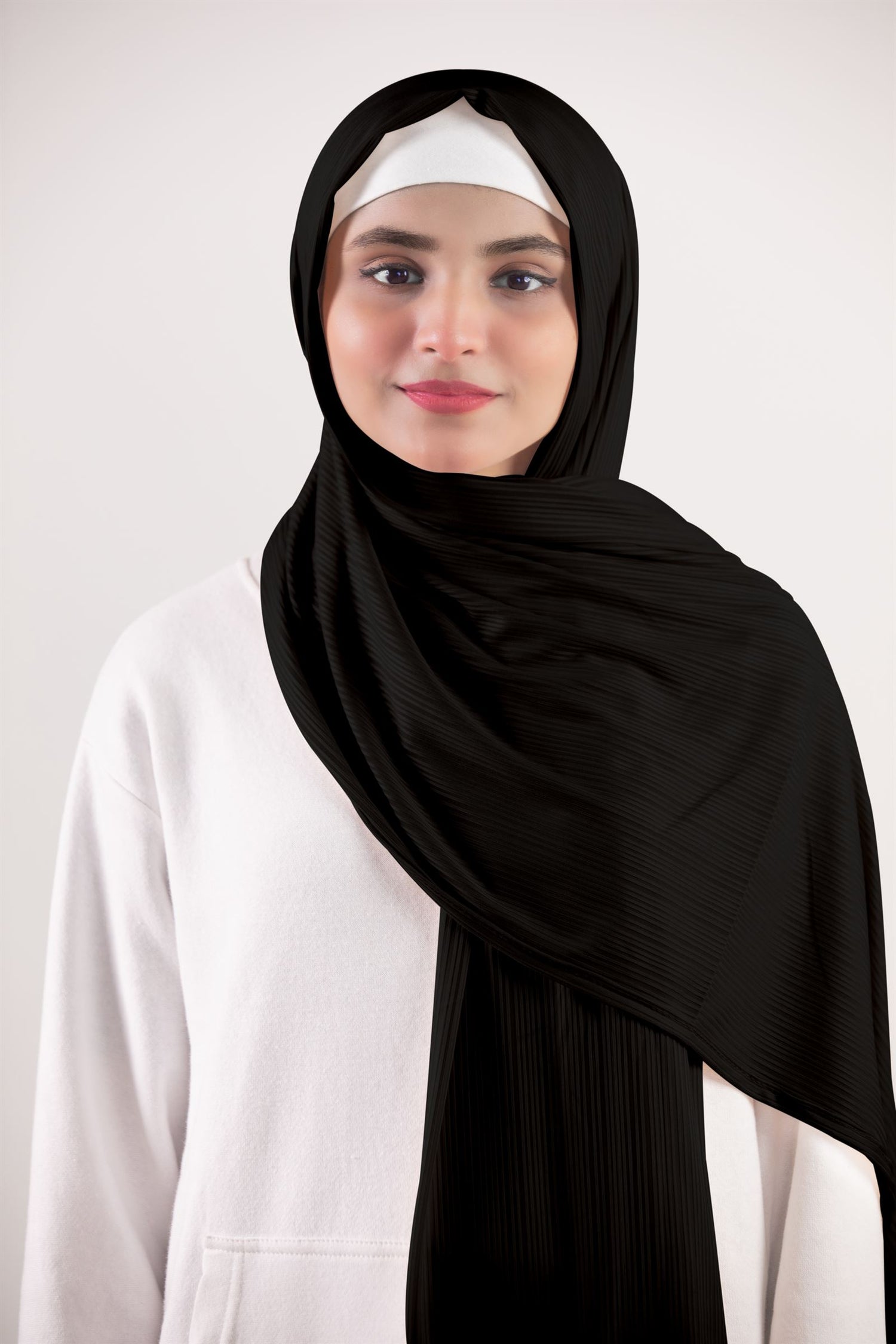 ribbed jersey hijab in balck color. elegant girl styling in hijab made from premium ribbed jersey fabric.