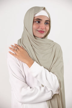 Elegant Pearl White Ribbed Jersey Hijab draping gracefully on a modern hijabi.