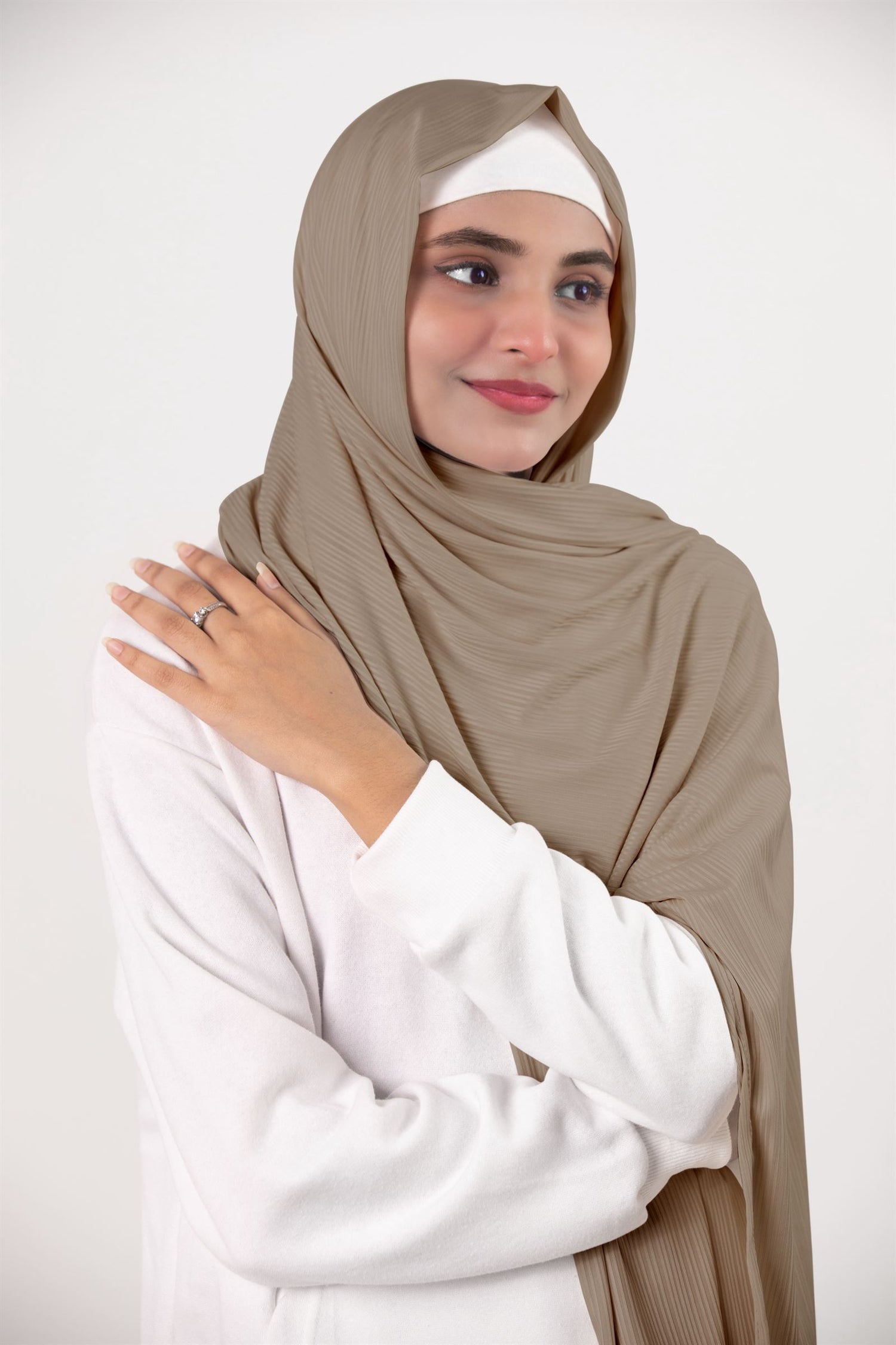 Ribbed Jersey Hijab in Oatmeal. Fashion-forward hijabi draping it for an elegant an chic appearance. 