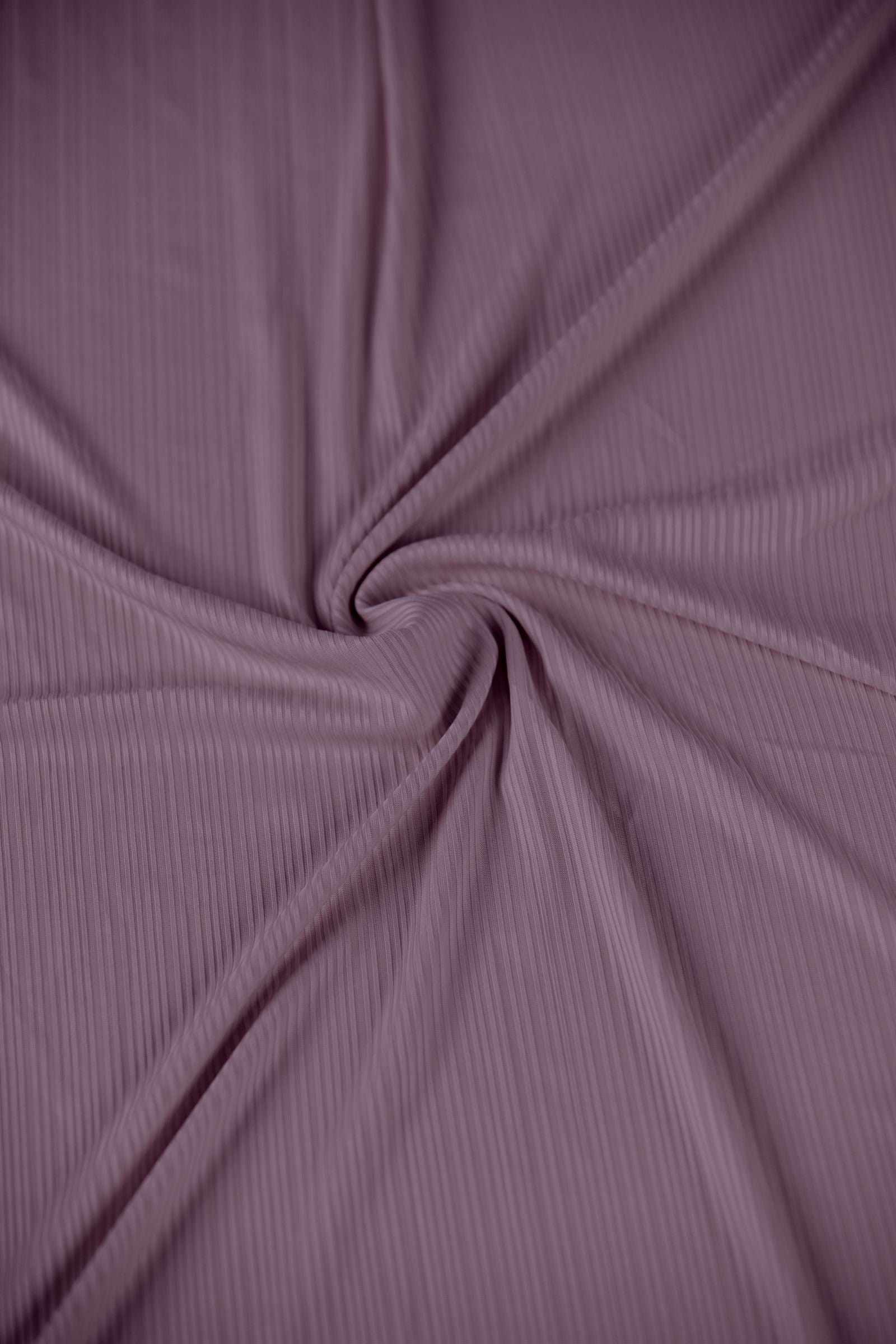 Stylish Ribbed Jersey Hijab in Dusty Pink enhancing an outfit.