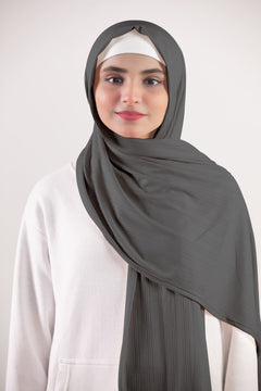 Ribbed Jersey Hijab in dusky sage. Individual wearing a stylish hijab made of premium ribbed jersey for a chic appearance.