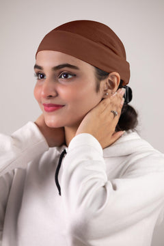 Girl wearing Everyday Soft tube Hijab inner cap in Brown Color. Premium fabric.