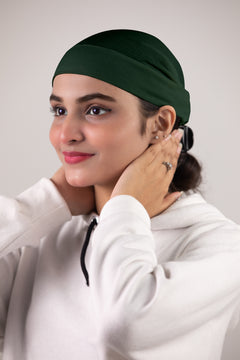 Girl Wearing Soft Tube Hijab Cap in Bottle Green Shade.