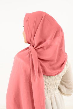 a women wearing instant hijab with cap in rose pink color georgette material back side