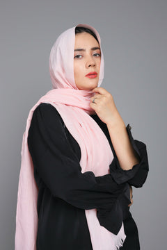 Woman wearing a Pastel Pink Turkish Hijab, styled beautifully to highlight its non-slippery design.