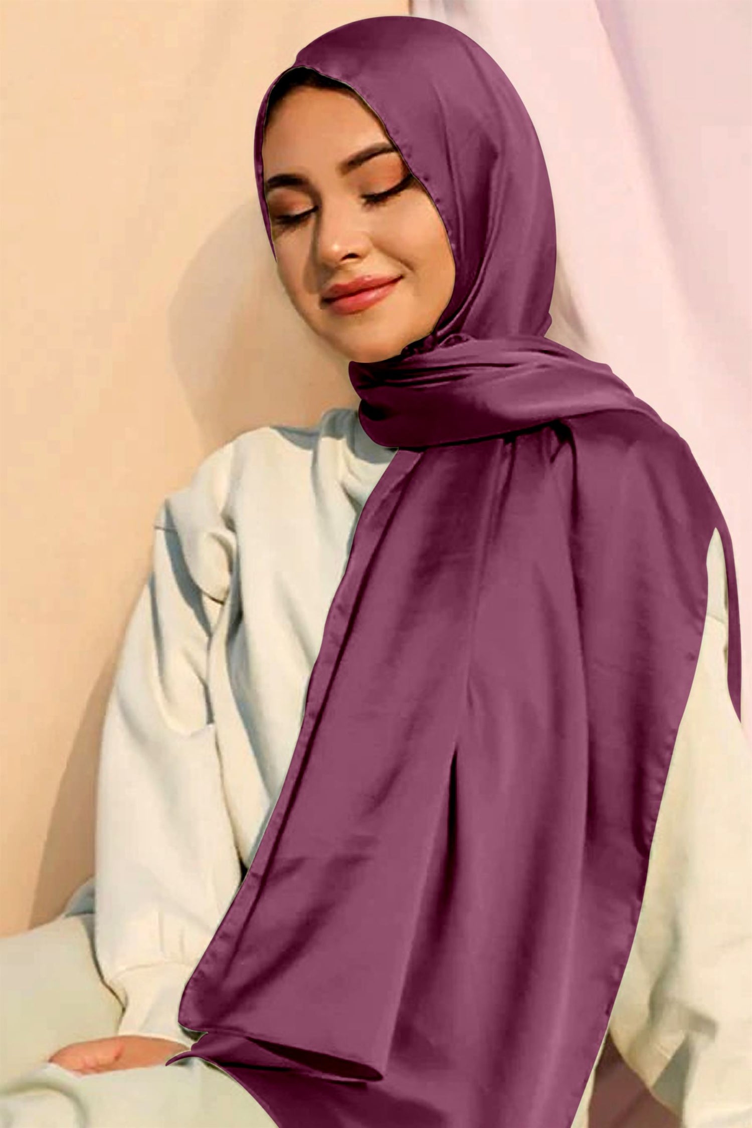 A woman draped in an Light purple Satin Silk Hijab.