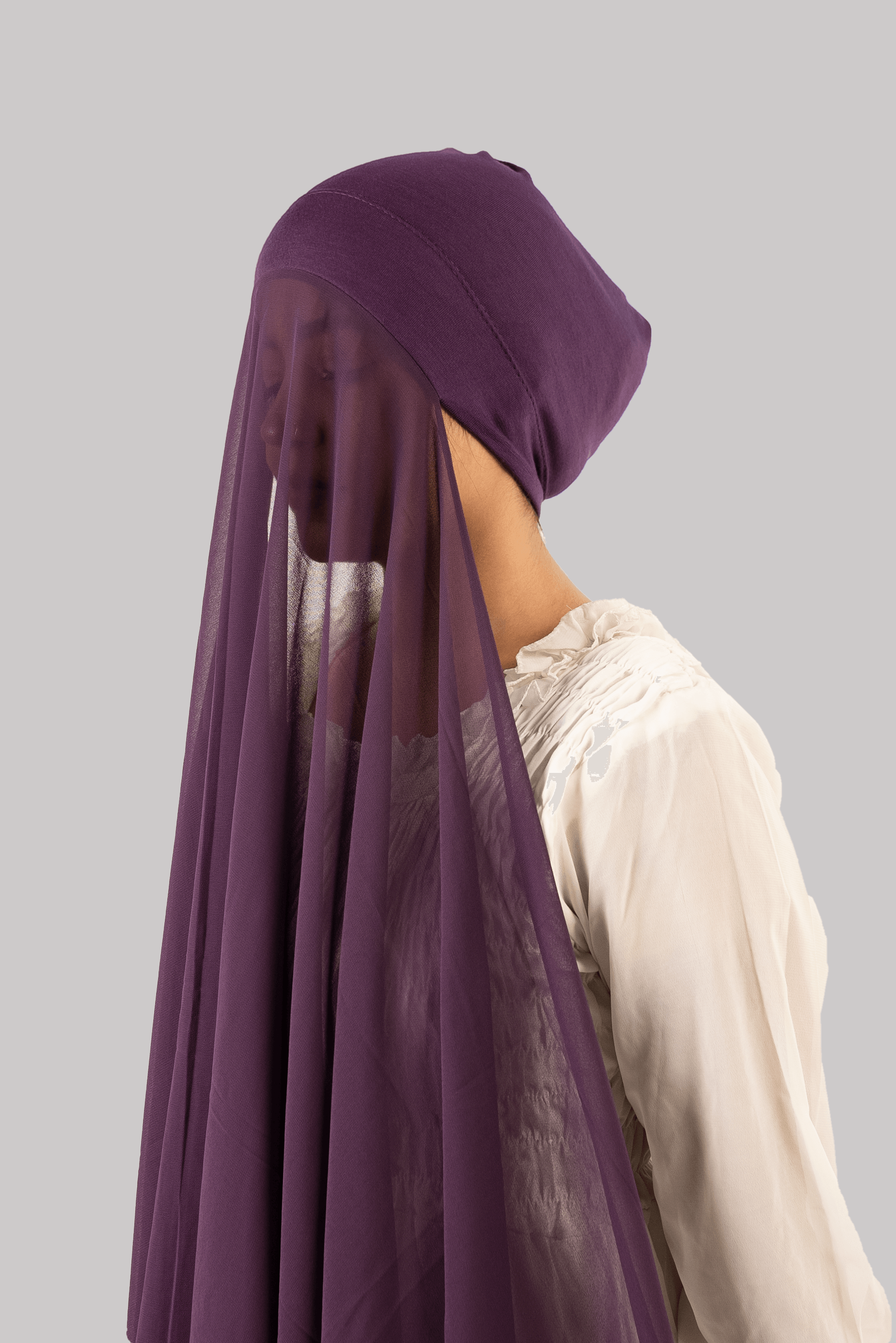girl wearing georgette instant hijab with undercap attached. Purple Instant Scarf in side profile.