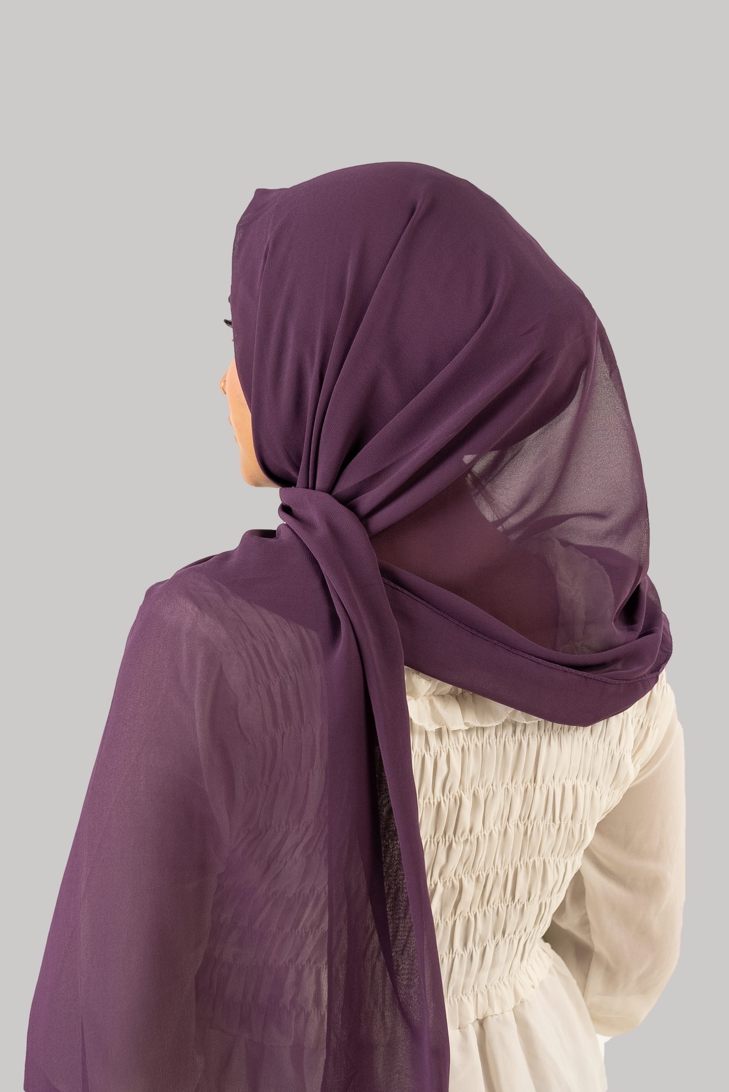 a women wearing georgette instant hijab attached with cap purple color 'back side