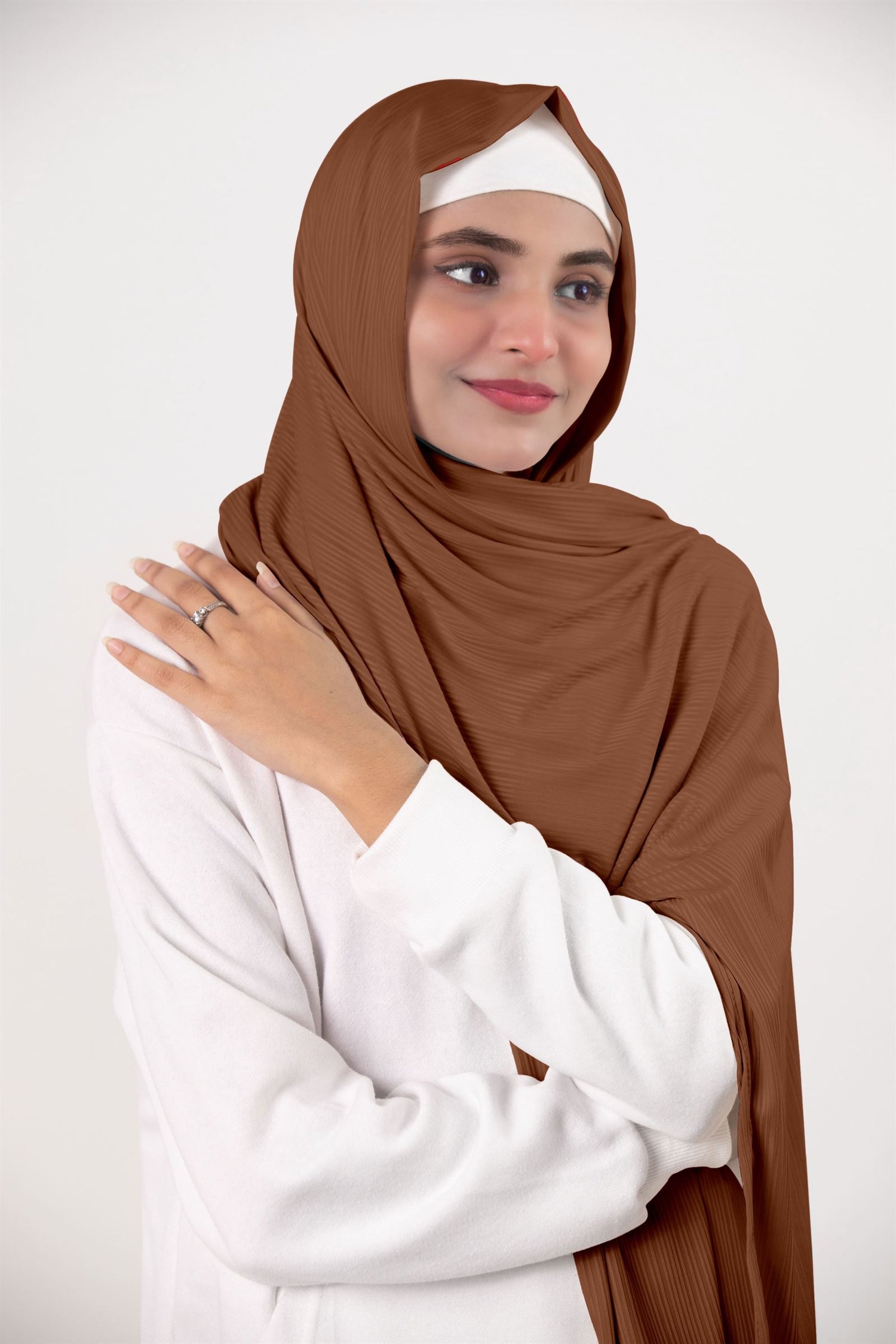 Ribbed Jersey Hijab in dark brown draping elegantly on a stylish hijabi.