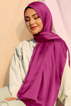 woman in a lightweight and breathable Satin Silk Hijab in Shocking pink.