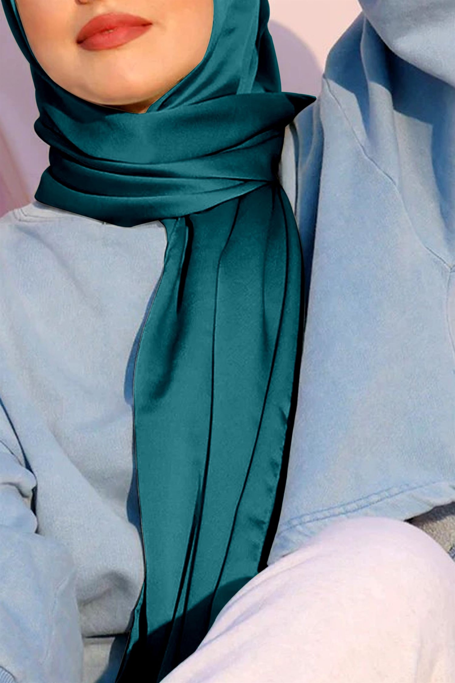 Satin Silk Hijab in teal color. Woman wearing Hijab made fro premium satin silk fabric.