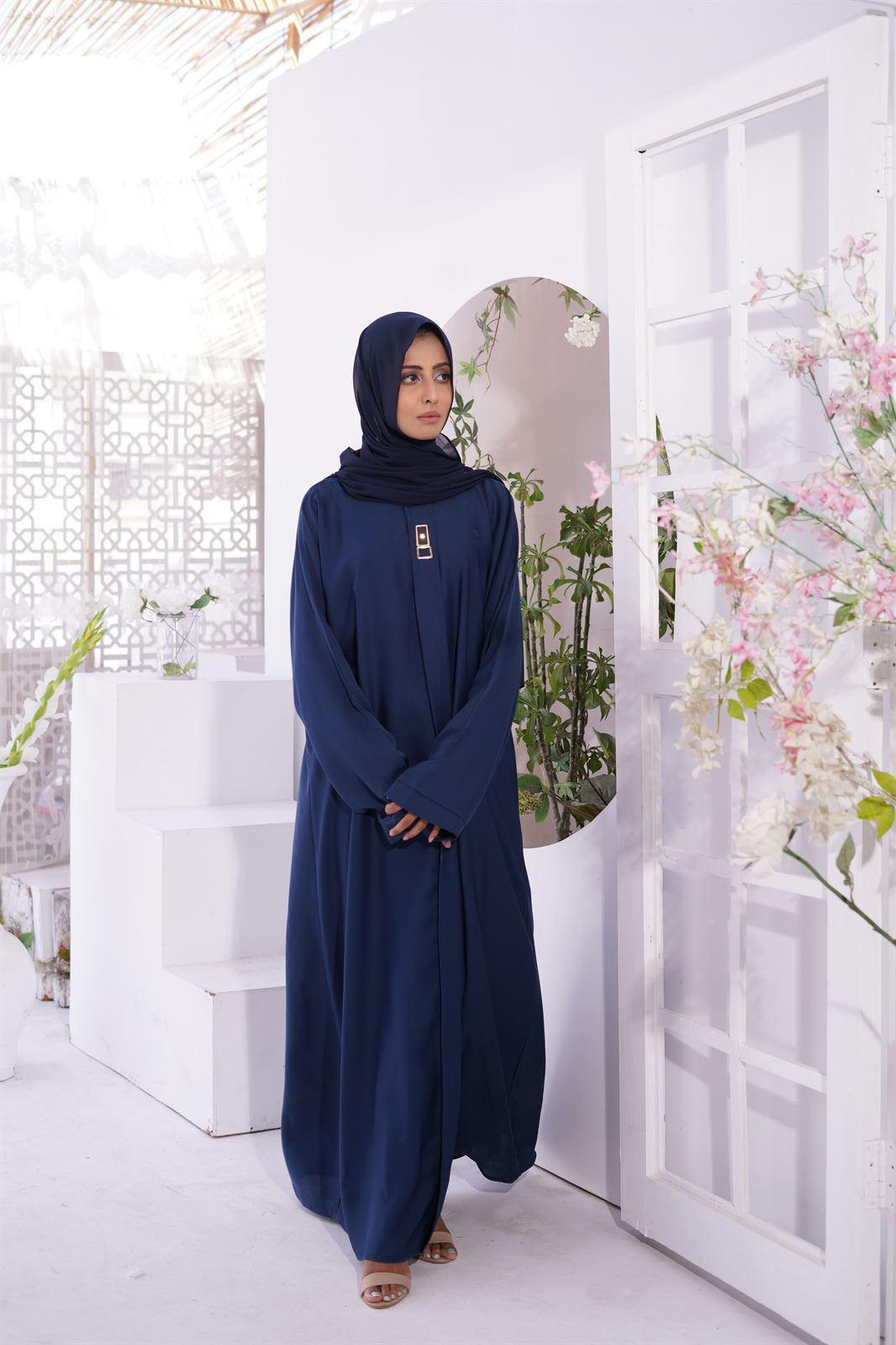 Woman wearing burqa. Luxury nida fabric Amirah Abaya in Navy Blue. Buy Abaya Online Pakistan.