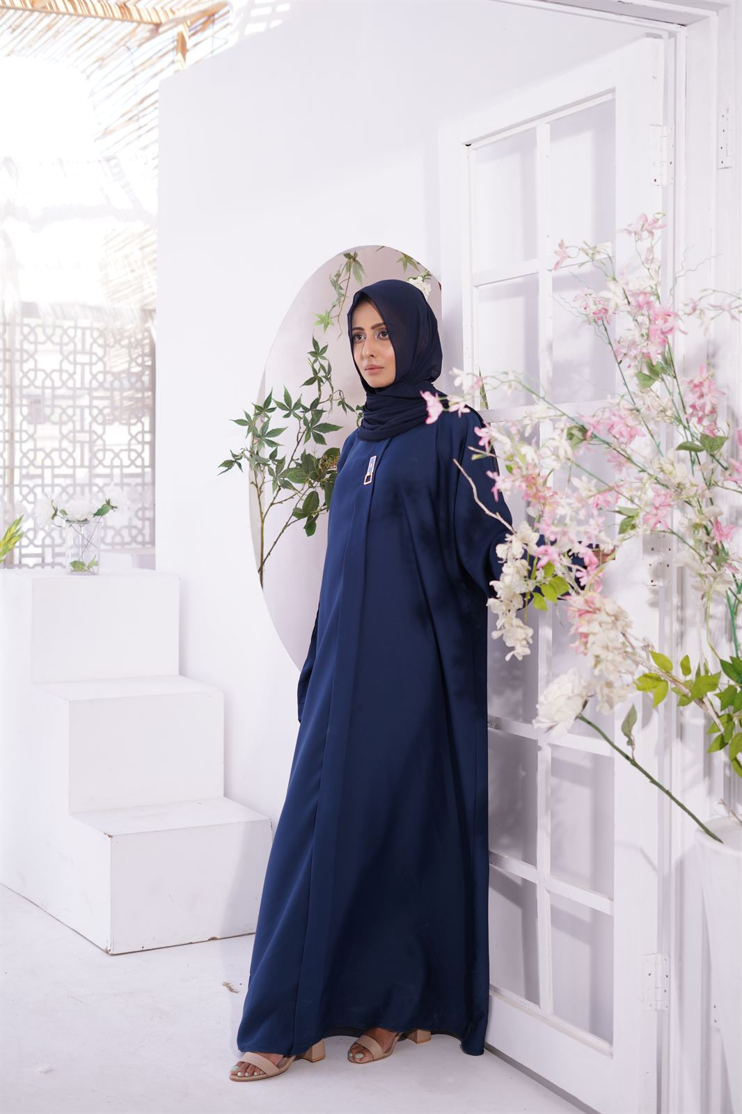 Woman wearing burqa. Luxury nida fabric Amirah Abaya in Navy Blue. Buy Abaya Online Pakistan.