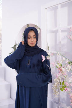 Woman wearing burqa. Luxury nida fabric Amirah Abaya in Navy Blue. Buy Abaya Online Pakistan.