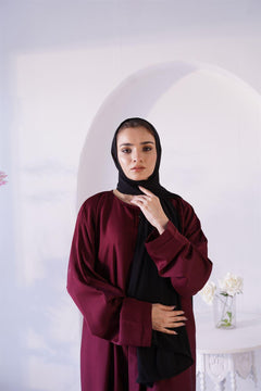 Woman Wearing Amirah abaya in maroon. Buy Luxury abaya Online at hijabandco. 