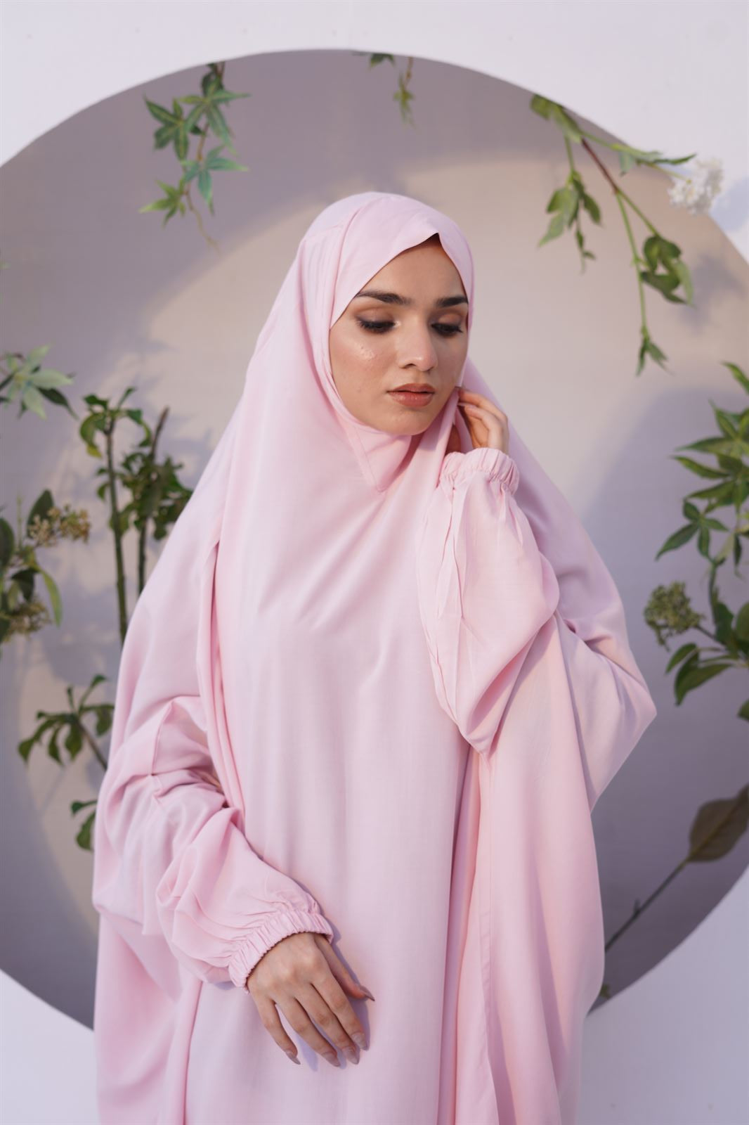 a women wearing Chadar for Namaz in baby pink color