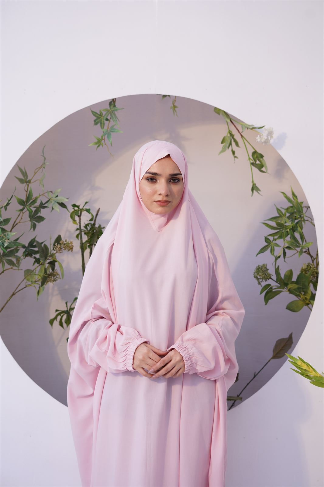 a women wearing Chadar for Namaz in baby pink color