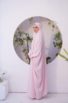 a women wearing Chadar for Namaz in baby pink color