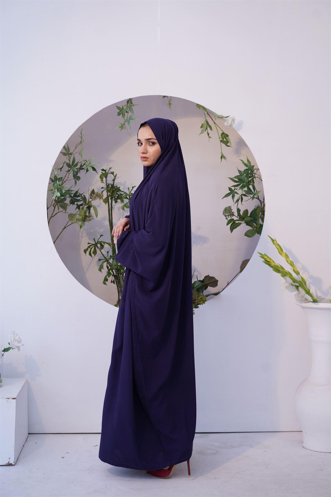 SIde view of girl wearing namaz chadar with sleeves in navy blue.