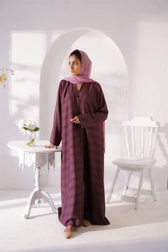 Girl wearing Zoom emboss abaya gown style in grape. Front View.