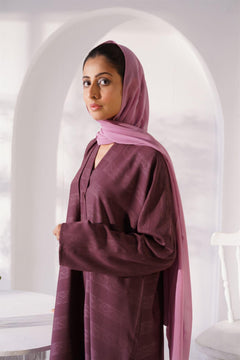 Girl wearing Zoom emboss abaya gown style in grape. Closeup.