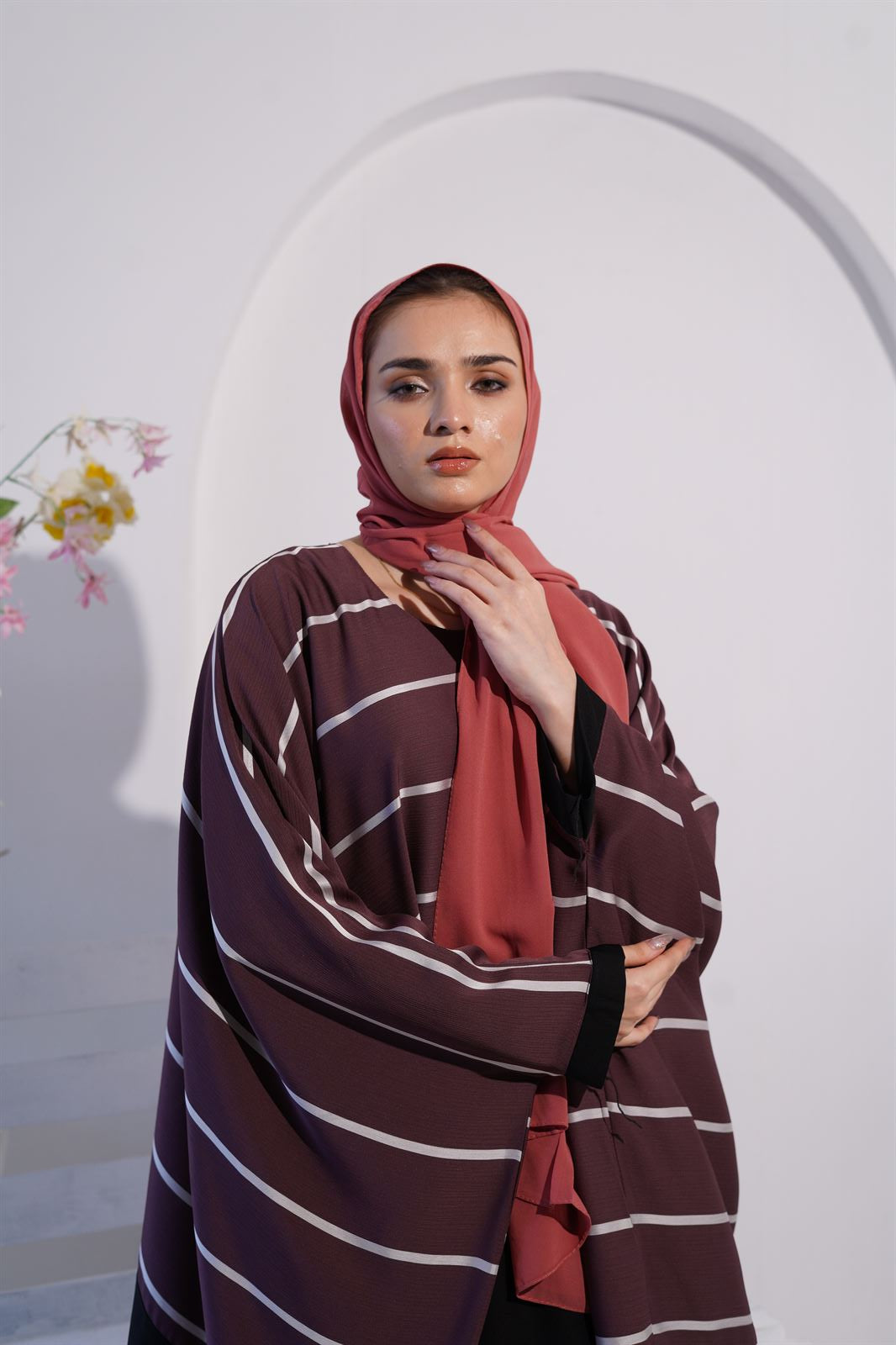 a women wearing jilbab abaya collection in deep mauve color