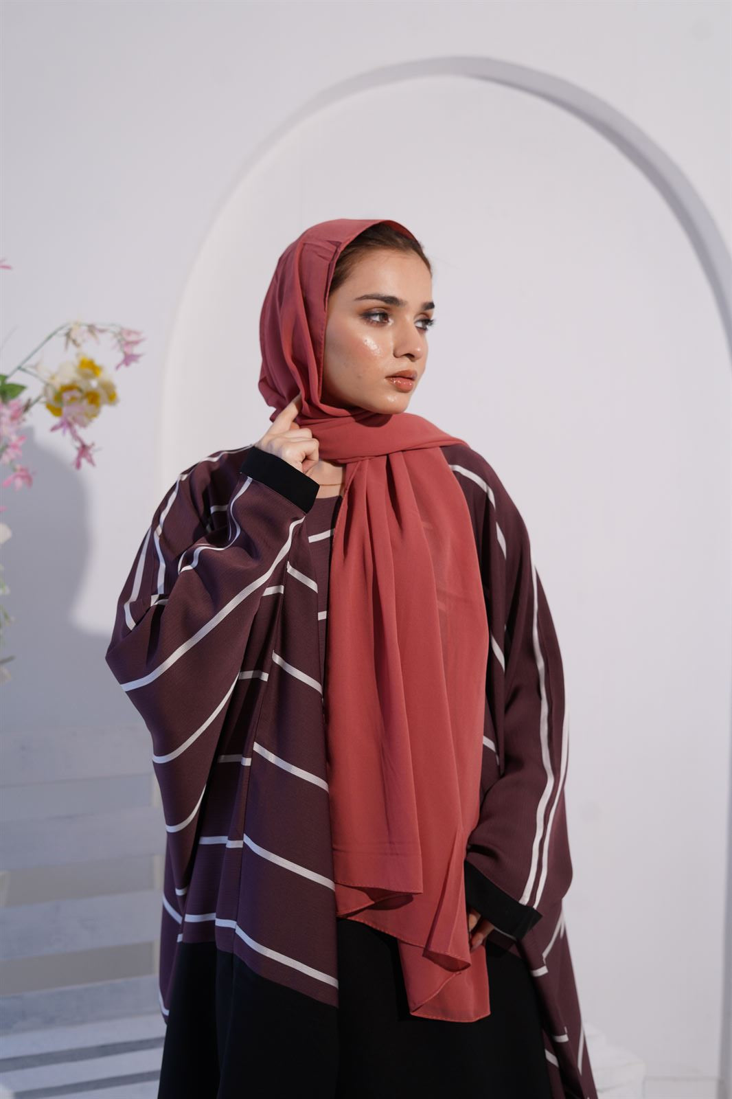 a women wearing jilbab abaya collection in deep mauve color