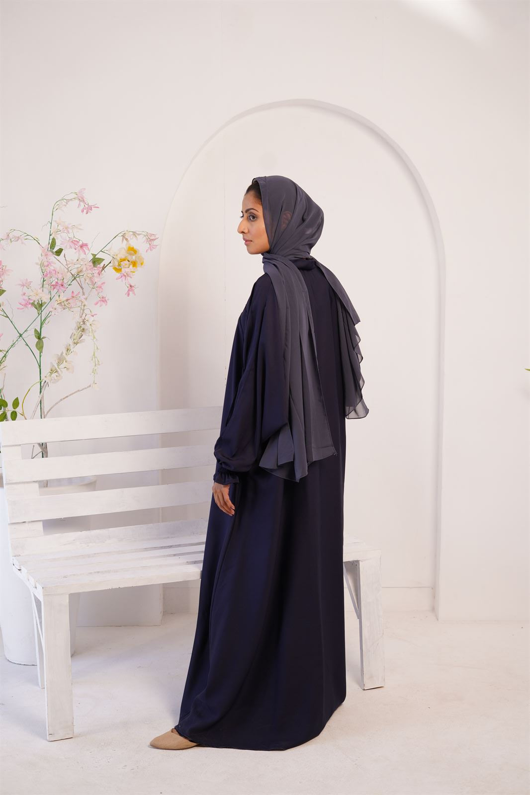 Side view. Girl wearing royal blue Paintex Kaftan gown abaya. Buy Kaftan online.