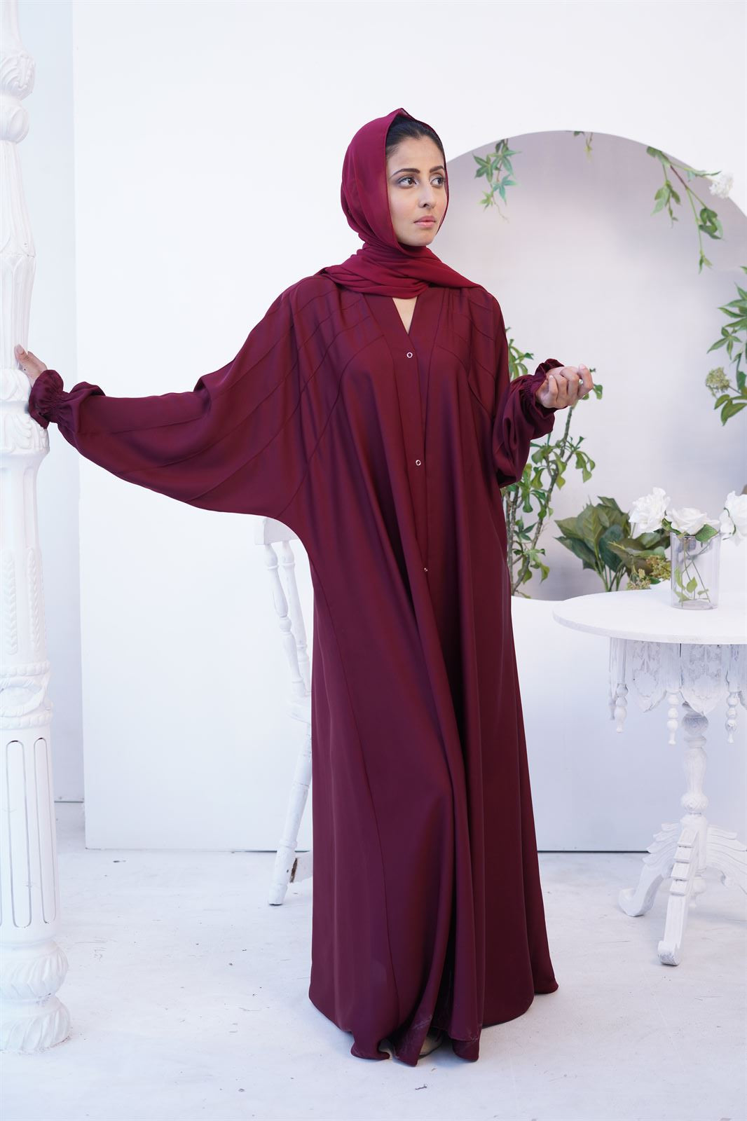 Girl Wearing Paintex Gown Style Kaftan abaya Online in maroon.