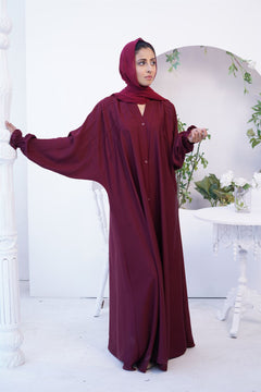 Girl Wearing Paintex Gown Style Kaftan abaya Online in maroon.