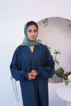 closeup of Girl Wearing Paintex Kaftan Gown Sea green Abaya front facing.