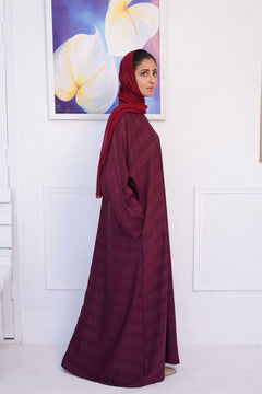 Buy Online abaya in pakistan. Girl wearing Zoom emboss gown abaya in mahogany.