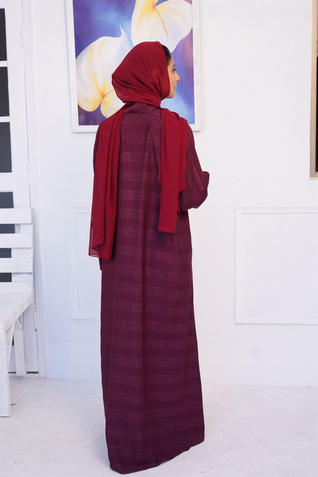 Buy Online abaya in pakistan. Girl wearing Zoom emboss gown abaya in mahogany. Back view.