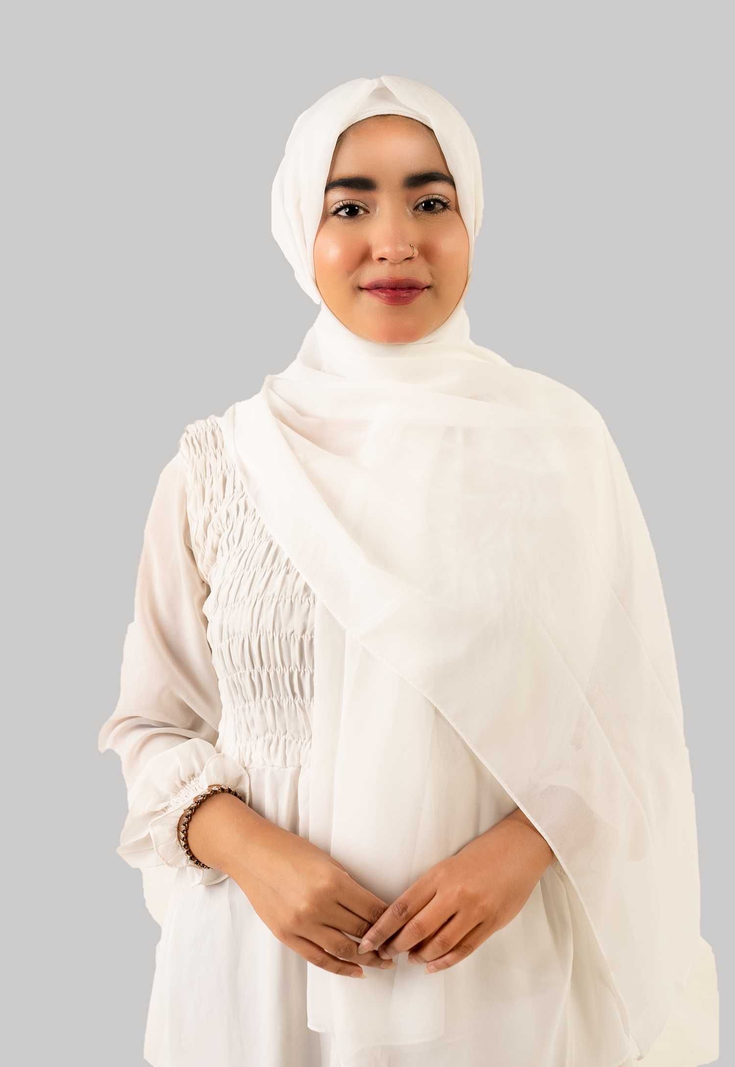 a women wearing instant hijab with cap in white color georgette material front side