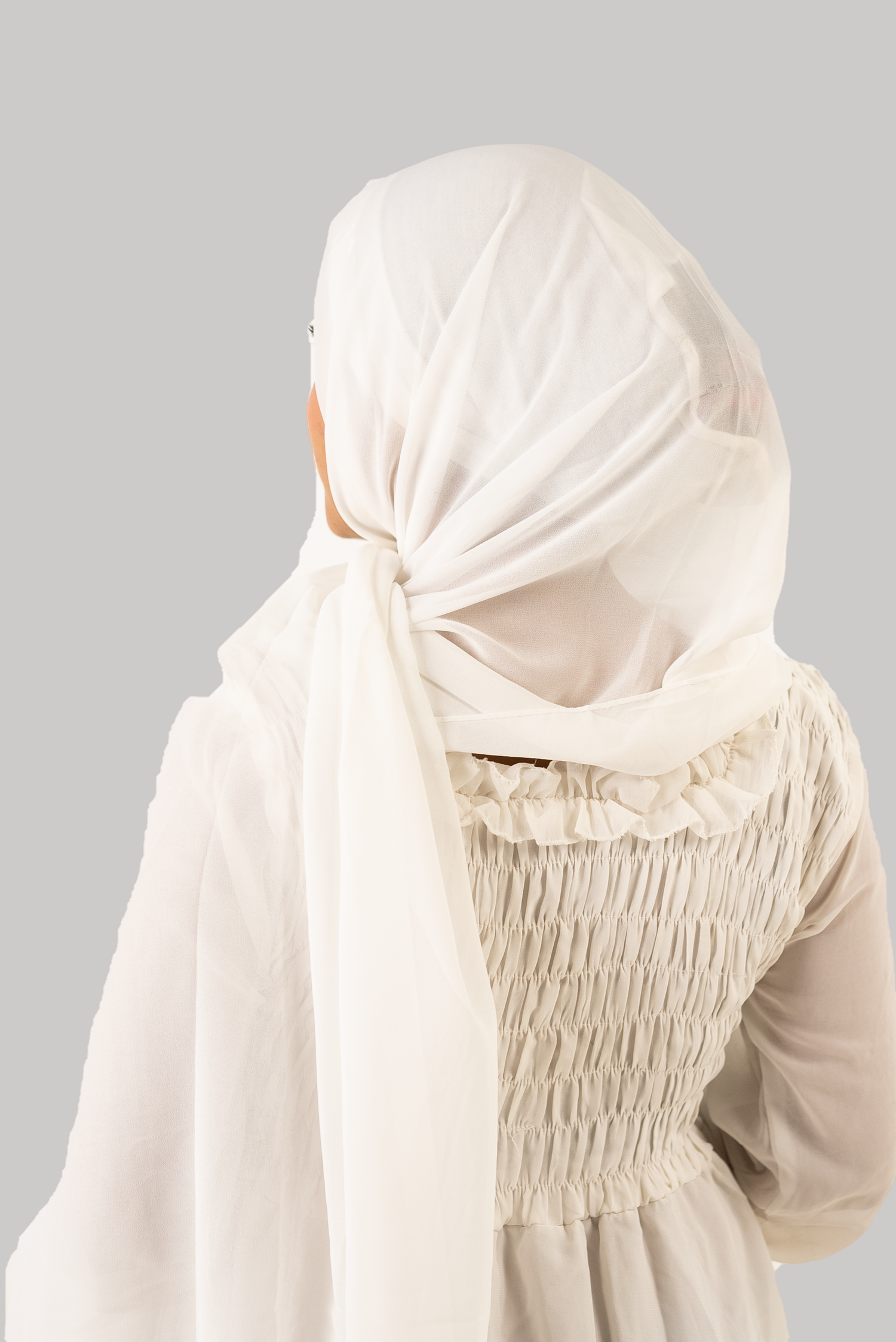 a women wearing instant hijab with cap white color georgette material back side