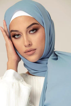 Georgette Hijab Online Pakistan, in sapphire. woman wearing over white top looking her straight.