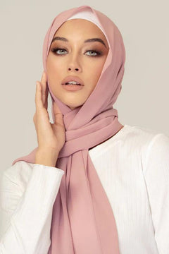 Girl wearing Dusty Pink Georgette Hijab Online, a white top and looking straight