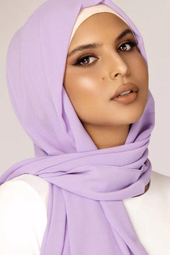 Georgette Hijab Online Pakistan, in LAVENDER color . a women wearing it with white top looking STRAIGHT.