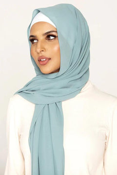 Georgette Hijab Online Pakistan, in Maldives color . a women wearing it with white top looking her right