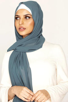 Georgette Hijab Online Pakistan, in yale color . a women wearing it with white top looking her right