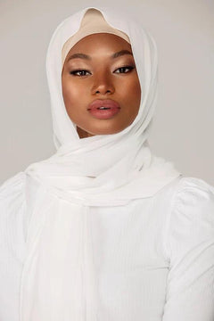 Plain White Georgette Hijab, a girl
styling with white top, looking straight.