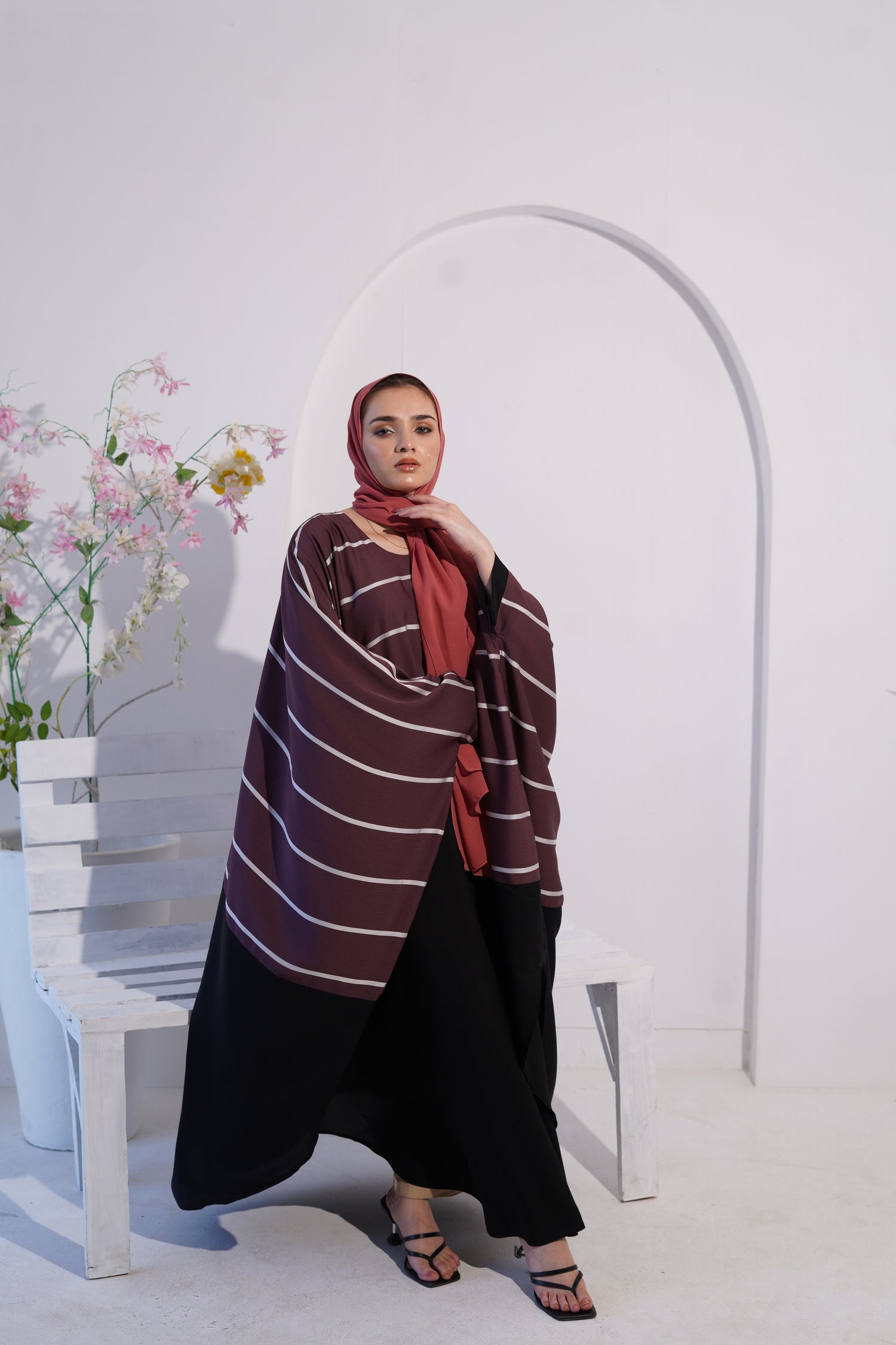 a women wearing jilbab abaya collection in deep mauve color