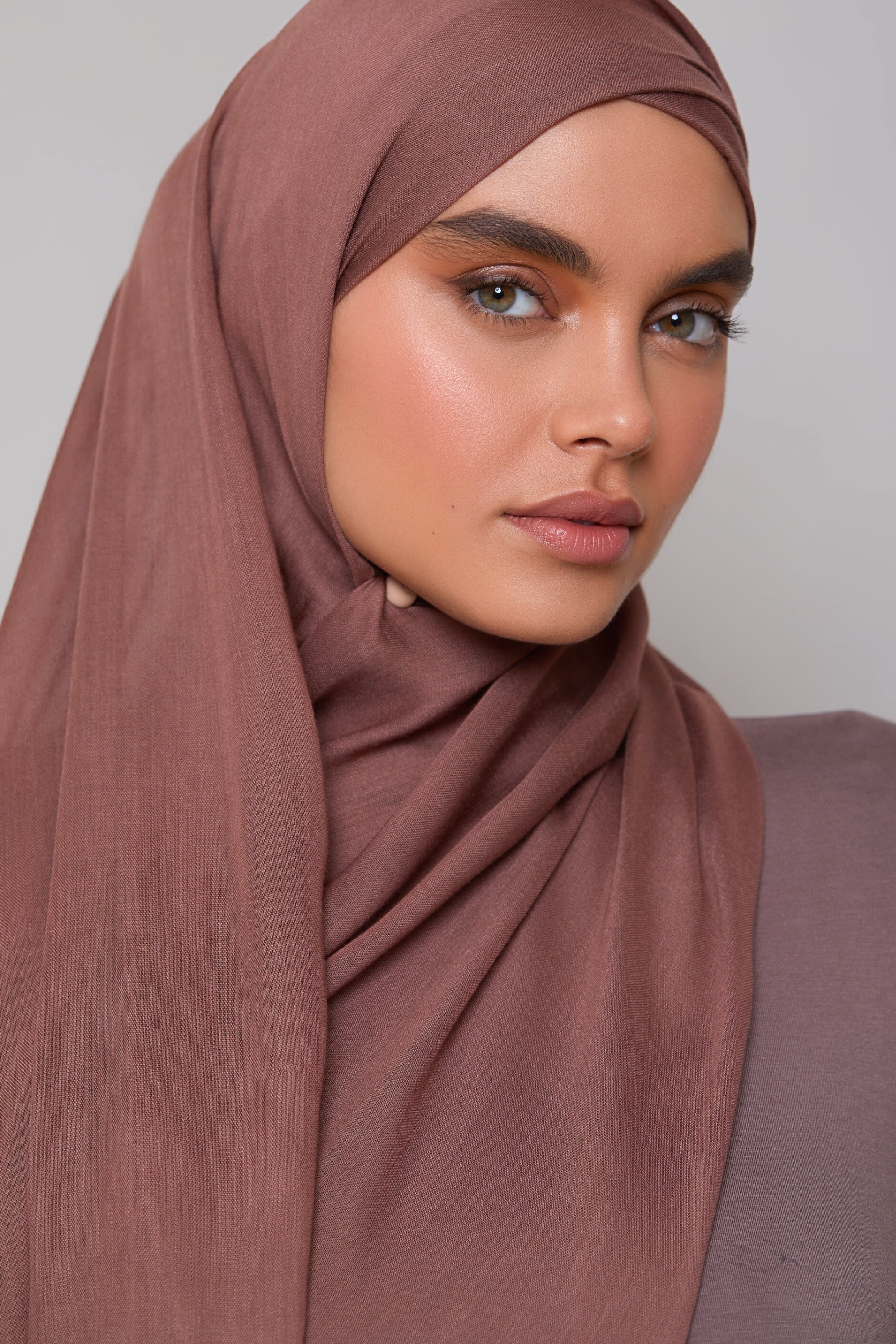 Girl wearing pecan shade modal fabric hijab. Shop Online in Pakistan.